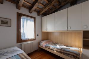 Posteľ alebo postele v izbe v ubytovaní Holiday House Petrarca