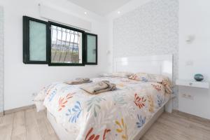 Łóżko lub łóżka w pokoju w obiekcie Luxury Poolside Holiday Home