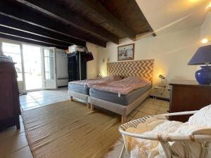 Ένα ή περισσότερα κρεβάτια σε δωμάτιο στο Villa Océan- Vue imprenable sur la côte Atlantique