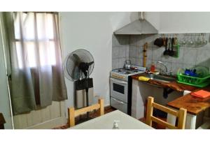 Kuchyň nebo kuchyňský kout v ubytování Hospedaje Los quebrachos