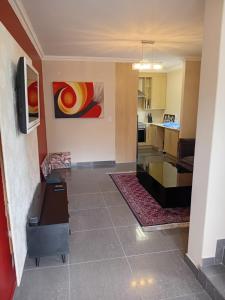 a view of a living room and a kitchen at 4C On Gillian in Sandton