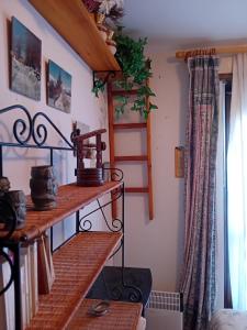a room with a shelf with a coffee maker on it at Panoramic Eagle in Montoso