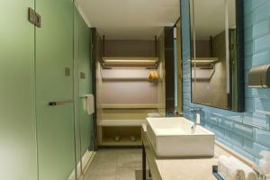 Vannituba majutusasutuses Echarm Hotel Hezhou Avenue