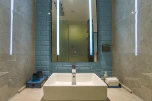 Vannituba majutusasutuses Echarm Hotel Hezhou Avenue