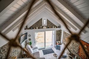 an overhead view of a living room with a large window at Casa Neverland in Vila Baleira +3 photos