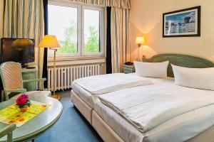 Postel nebo postele na pokoji v ubytování Wagners Hotel im Thüringer Wald