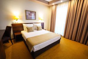 Hotel Monogram Park客房内的一张或多张床位