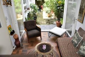 a living room with a couch and a chair at Urbanes Lebensgefühl in Basel in Basel