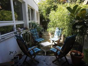 a group of chairs sitting on a patio at Urbanes Lebensgefühl in Basel in Basel