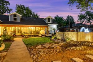 a home with a backyard with a fence at The Martin Frisco Stay & Play Hot tub, Pool & Firepit in Frisco
