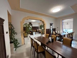 a dining room with a table and chairs at VT6 House & Restaurant in Znojmo
