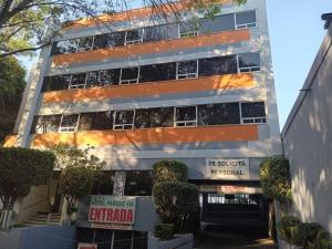 an external view of an apartment building at HOTEL PARQUE VIA in Mexico City