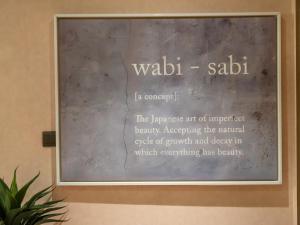 a chalkboard with the words wadiabil saadi on it at Wabi-Sabi Style Fountain-View 4 BR Apt in the Sky in Dubai +37 photos
