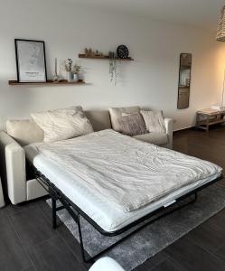 Postel nebo postele na pokoji v ubytování Ferienwohnung Lüttje Mööv an der Nordsee