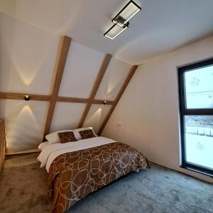 a bedroom with a bed and a window at Holiday home in Pale