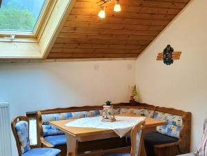 a dining room with a table and chairs at Bauernhof Gorihof in Aschau im Chiemgau