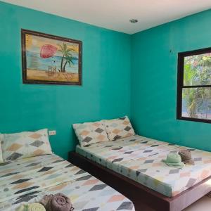 Postel nebo postele na pokoji v ubytování Chef Panyang Beach Resort Okoy