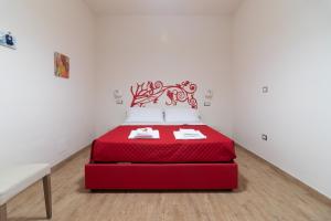 Postel nebo postele na pokoji v ubytování Hotel Maremma Sul Mare