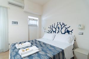 Postel nebo postele na pokoji v ubytování Hotel Maremma Sul Mare