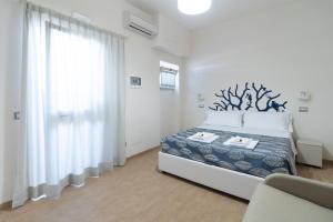 Postel nebo postele na pokoji v ubytování Hotel Maremma Sul Mare
