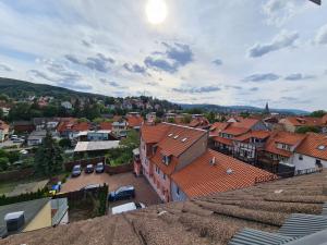 a view of a town with buildings and cars at Familienappartments- Fewo's Ahrend in Wernigerode