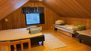 En eller flere senge i et værelse på Villa Livotar Syöte