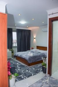 Postel nebo postele na pokoji v ubytování NEW ASSER HOTEL PYRAMID