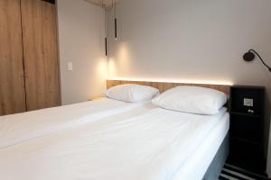 Posteľ alebo postele v izbe v ubytovaní Apartament 420 Green Port Basen & Jacuzzi Kołobrzeg