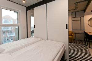 Posteľ alebo postele v izbe v ubytovaní Apartament 420 Green Port Basen & Jacuzzi Kołobrzeg