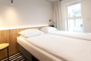 Posteľ alebo postele v izbe v ubytovaní Apartament 420 Green Port Basen & Jacuzzi Kołobrzeg