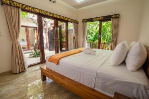 Кровать или кровати в номере Amed Paradise Beach Club