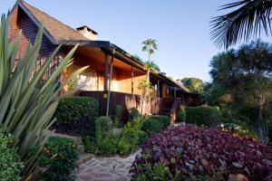 a house with a garden in front of it at Naro Moru River Lodge in Naro Moru