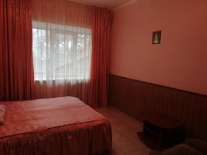 Postel nebo postele na pokoji v ubytování ГОТЕЛЬ Заводу 410 ЦА