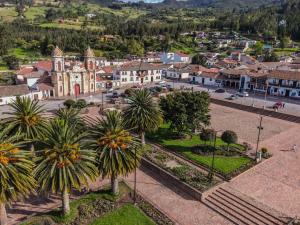 an aerial view of a town with palm trees at Hotel Casa Valentino in Tibasosa