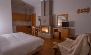 A bed or beds in a room at Asteras Hotel