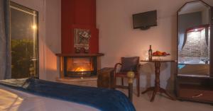 A bed or beds in a room at Asteras Hotel