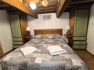 a bedroom with a bed with two pillows on it at 23 Mountain Views & Poolside Bliss Wi-Fi and Parking Free! in Castel del Piano