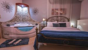 A bed or beds in a room at Asteras Hotel