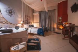 A bed or beds in a room at Asteras Hotel