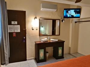 TV a/nebo společenská místnost v ubytování Hotel Rath