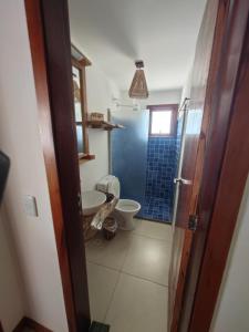 a bathroom with a toilet and a sink and a shower at Casa Signore Ventoforte in Caucaia