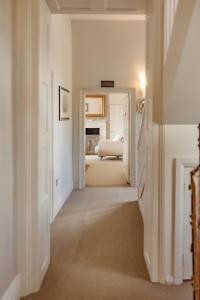 Ένα ή περισσότερα κρεβάτια σε δωμάτιο στο The Woodbridge Waterfront Rooms