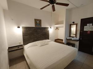 Postel nebo postele na pokoji v ubytování Hotel Rath