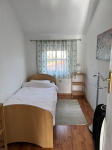 Postel nebo postele na pokoji v ubytování Apartmani Breze