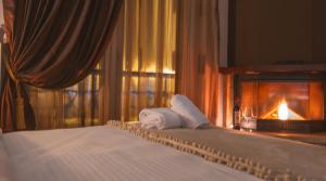 A bed or beds in a room at Asteras Hotel