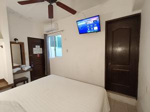 Postel nebo postele na pokoji v ubytování Hotel Rath