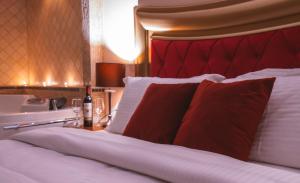 A bed or beds in a room at Asteras Hotel