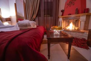 A bed or beds in a room at Asteras Hotel