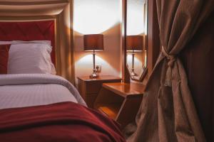 A bed or beds in a room at Asteras Hotel