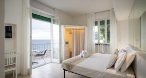 Posteľ alebo postele v izbe v ubytovaní Hotel Ligure